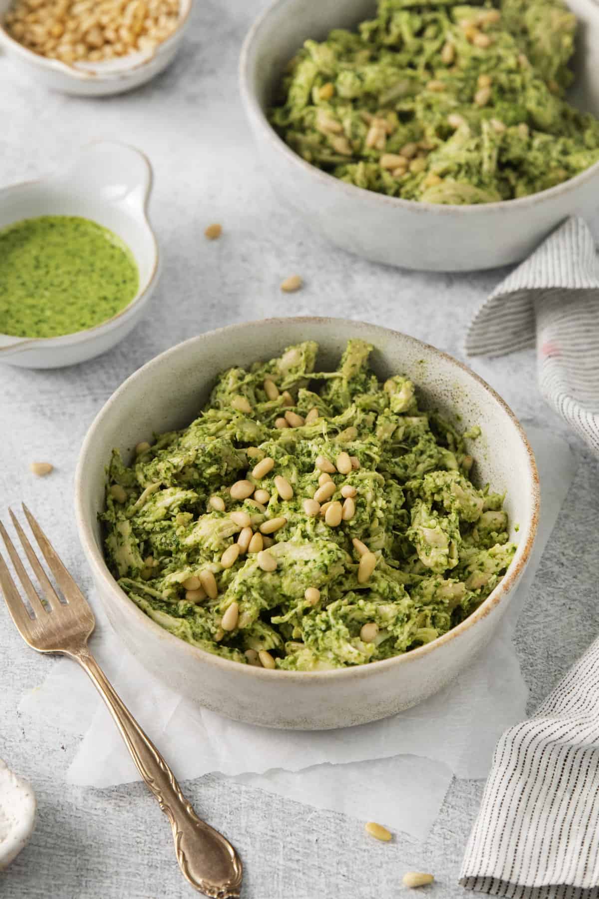 overhead of a bowl of chicken salad next to a fork.