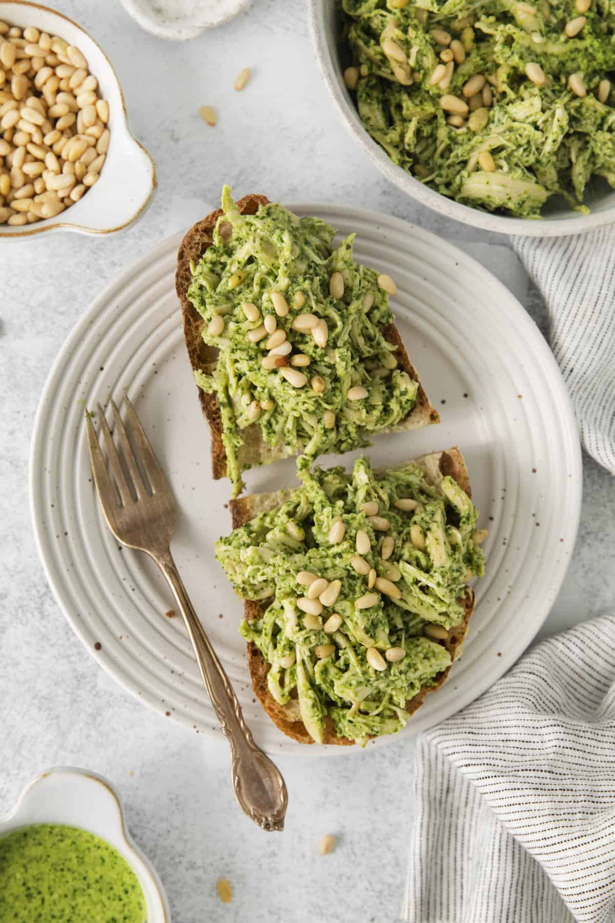 overhead of two halves of bread on a plate covered in chicken salad.