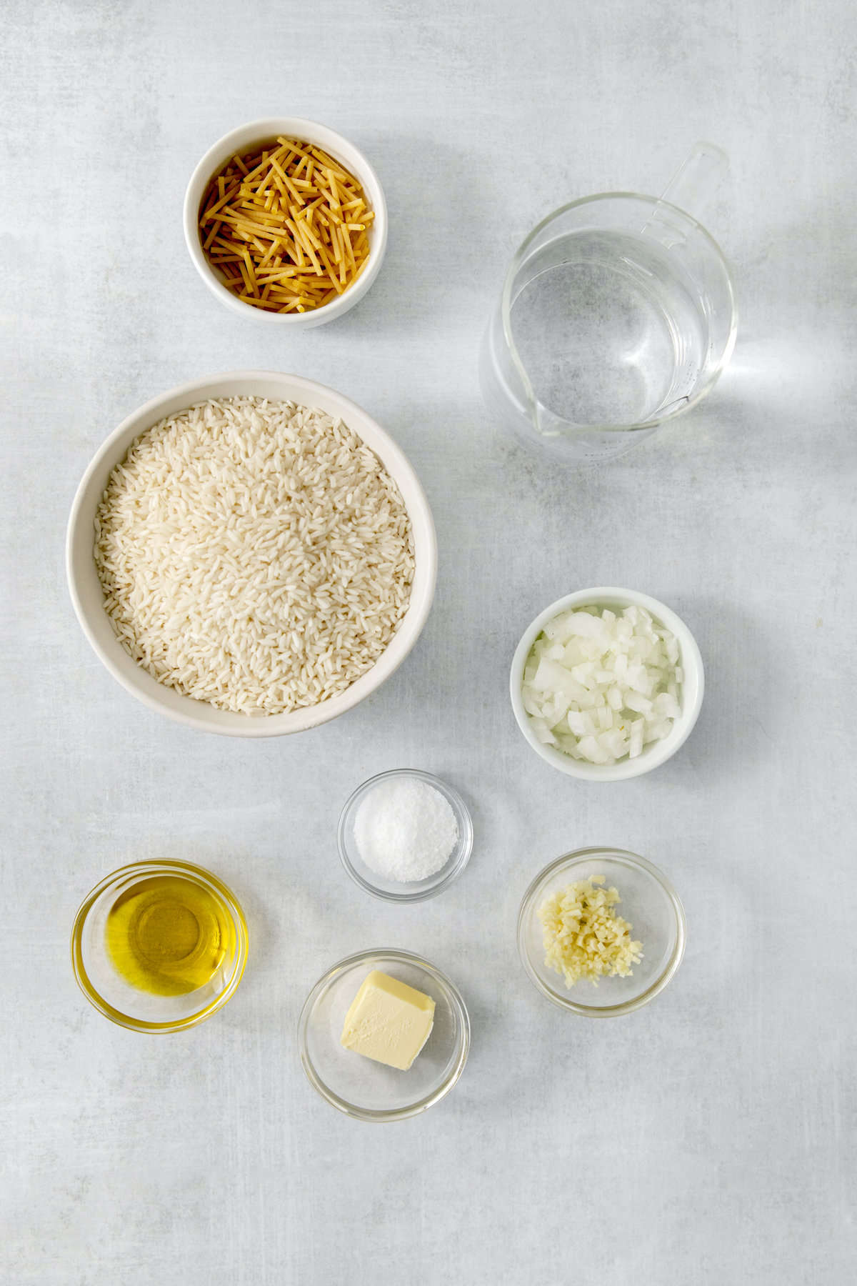 pilaf rice ingredients in separate dishes.