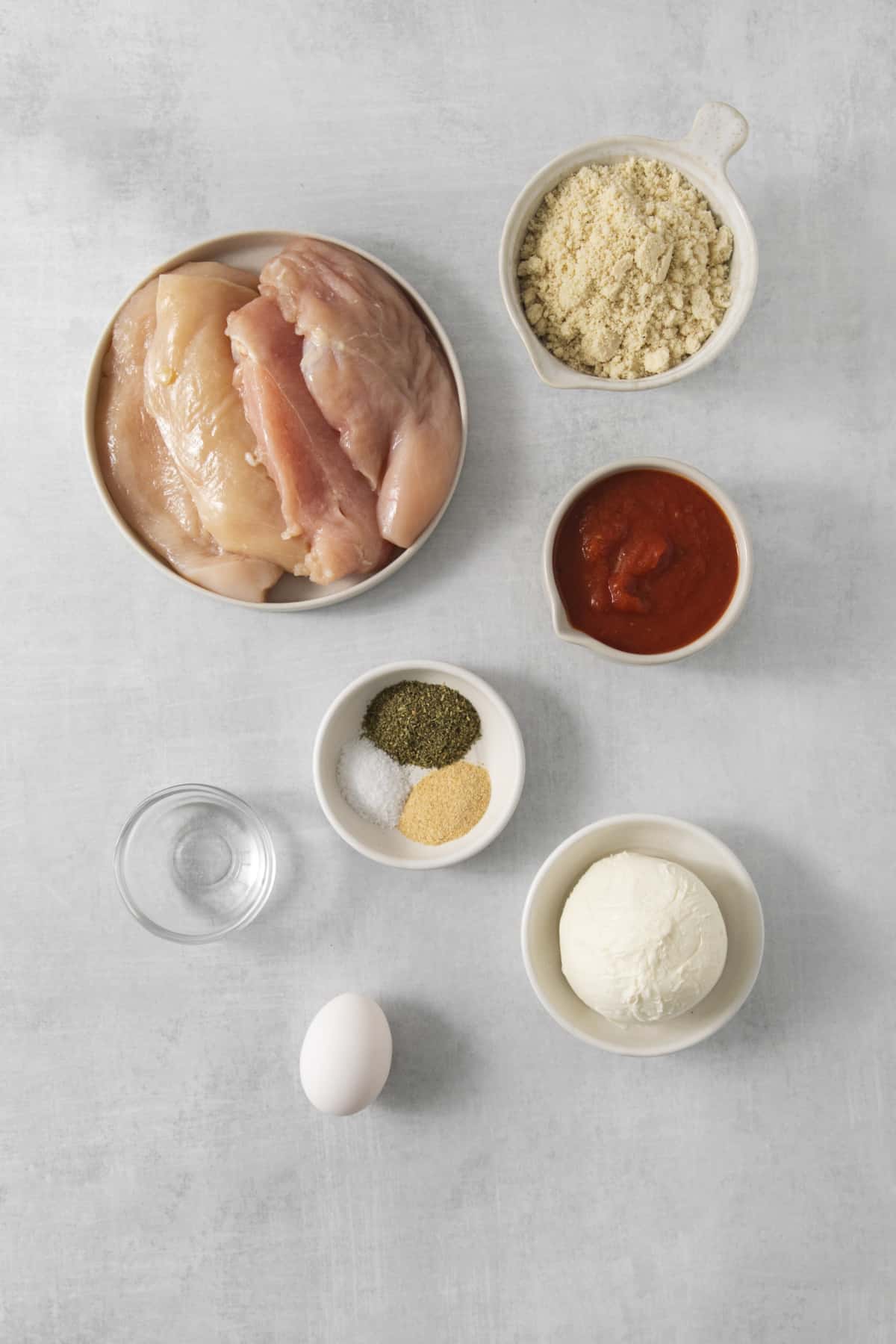 chicken parmesan ingredients in separate dishes.