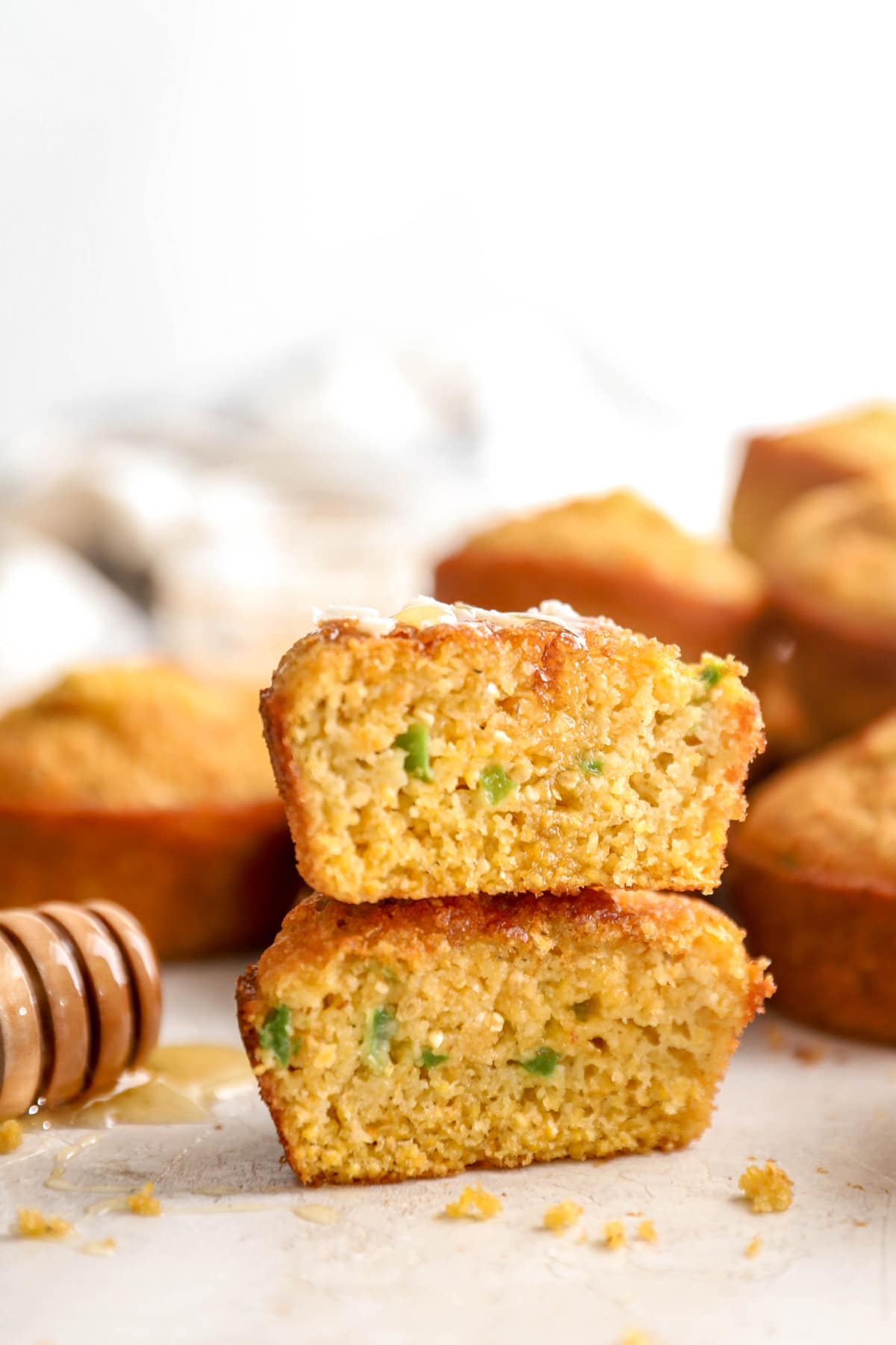 two halves of cornbread muffins stacked.