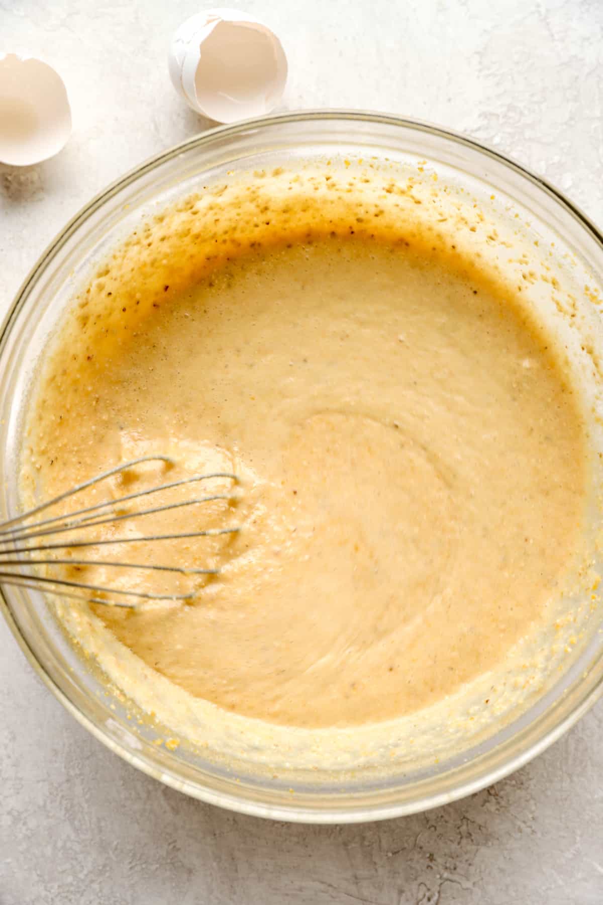 above image of cornbread batter in a mixing bowl.