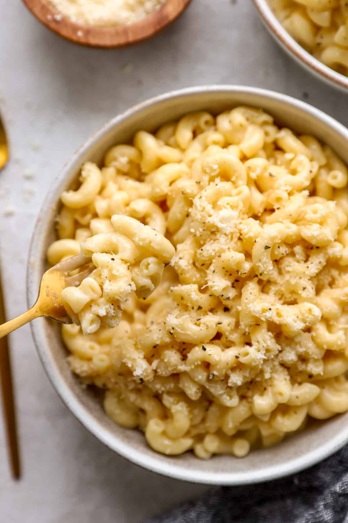 A big bowl of Instant Pot Mac and Cheese with a forkful of mack and cheese
