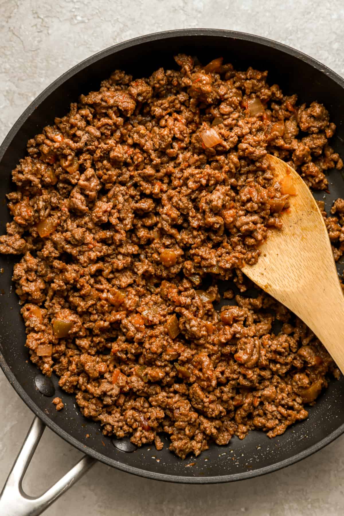 cooked ground beef in a skillet from above.