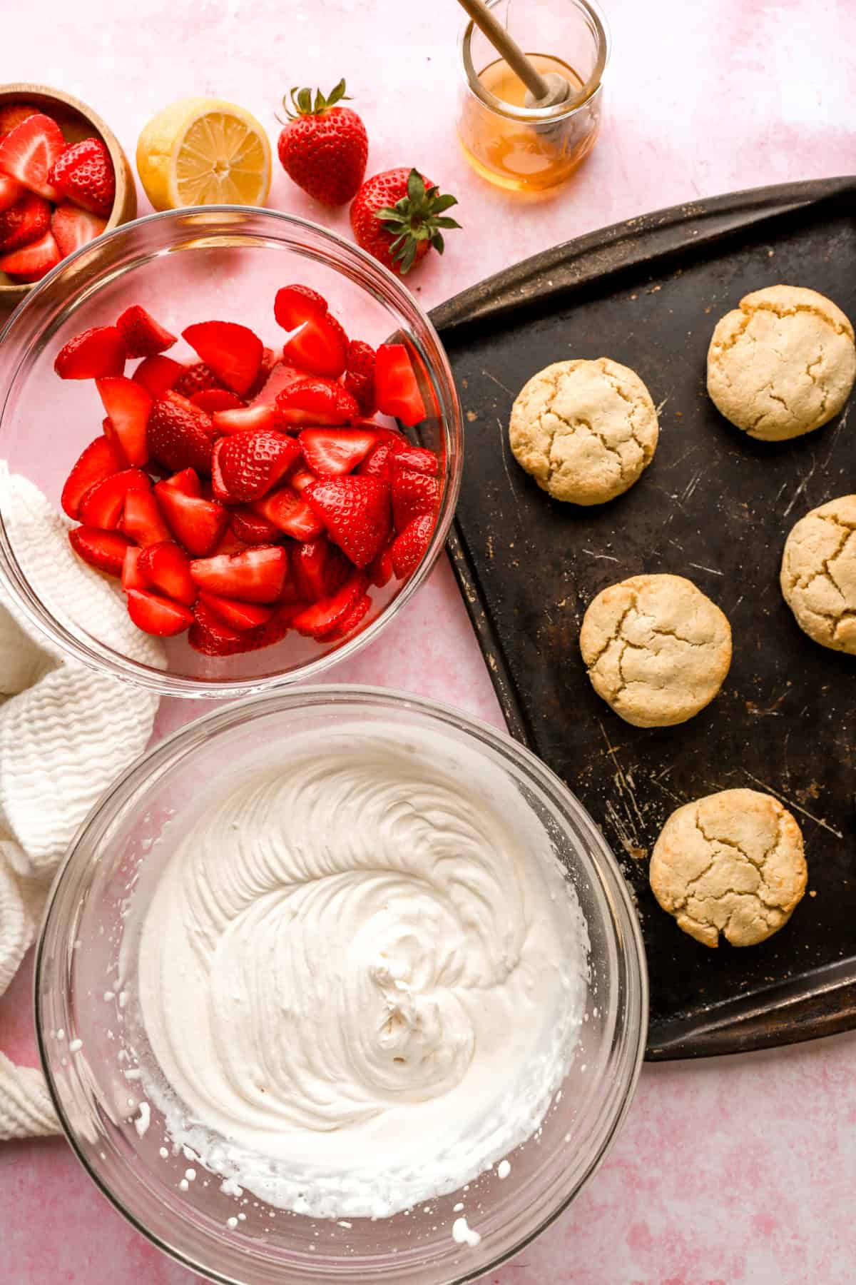 Drop biscuits, macerated strawberries, and coconut whipped cream. 