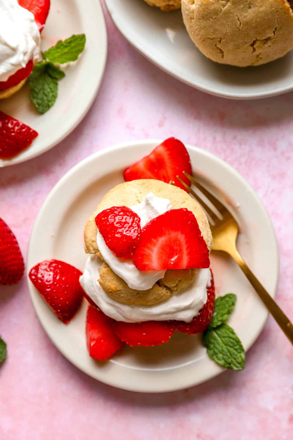 Overhead view of a gluten free strawberry shortcake on a plate. 
