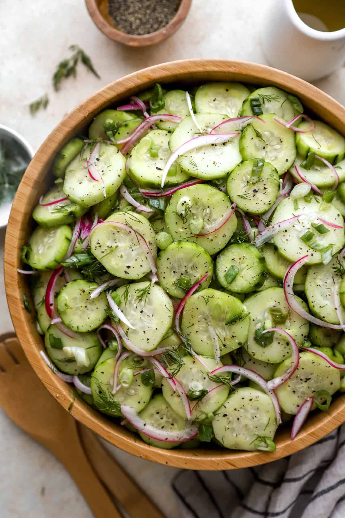 A bowl of sweet cucumber salad.