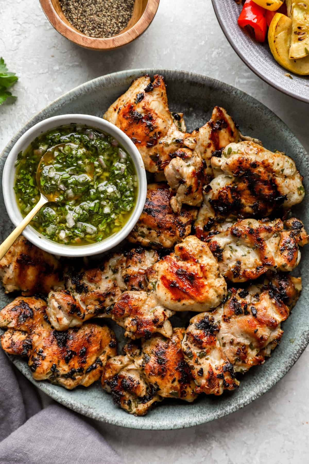 A plate of grilled chimichurri chicken. 