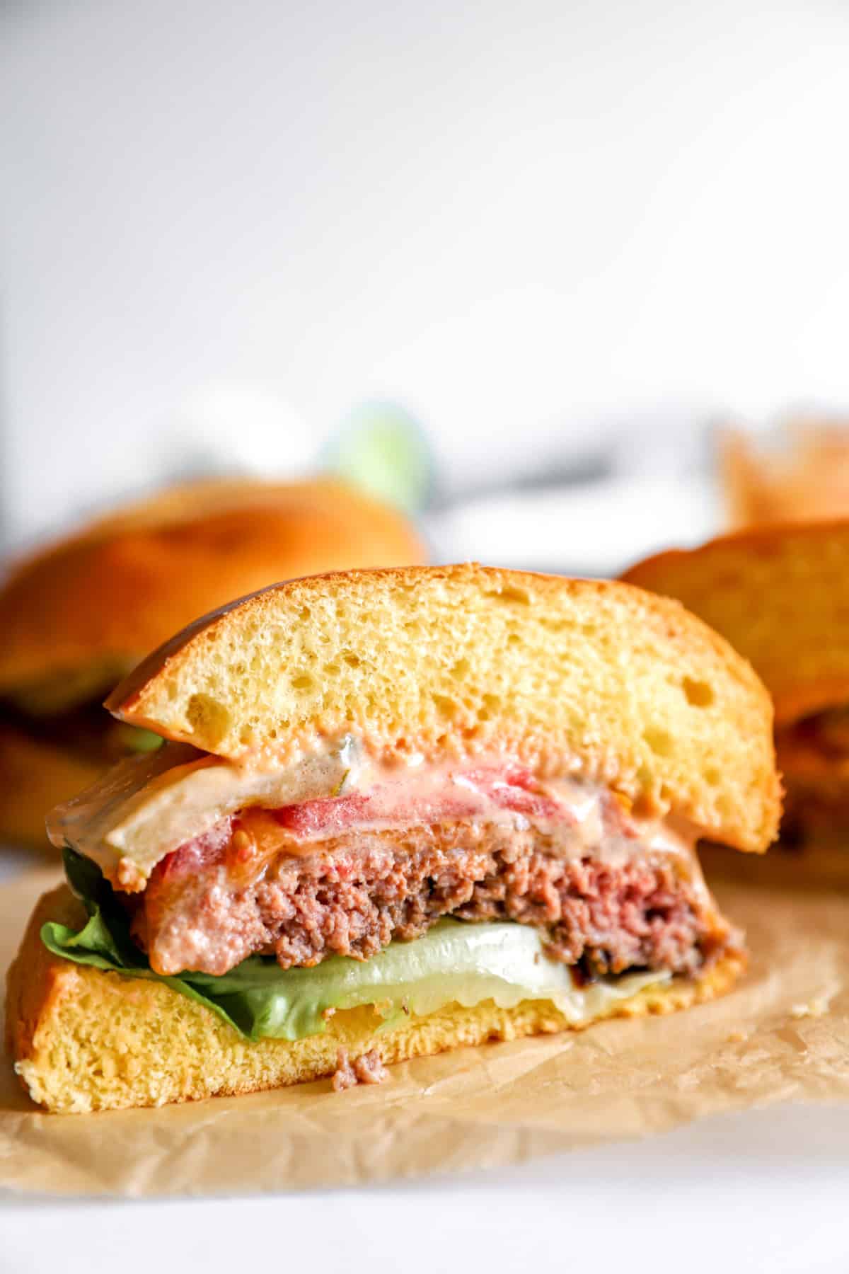 A smash burger sliced in half. 