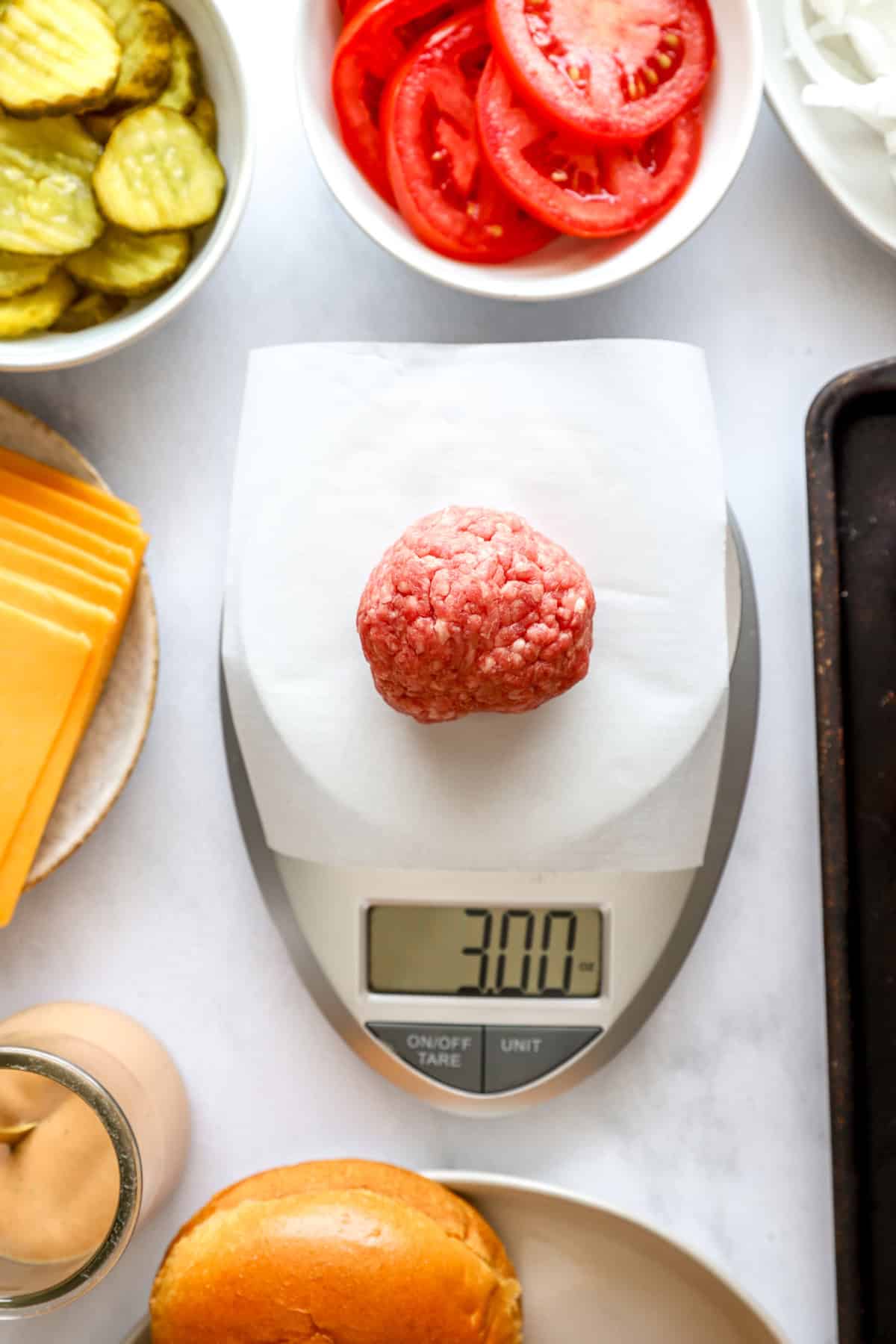 Ground beef being portioned into 3 ounce balls.