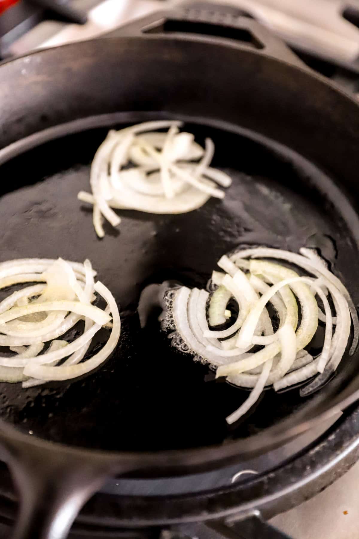 Onions cooking in a skillet. 