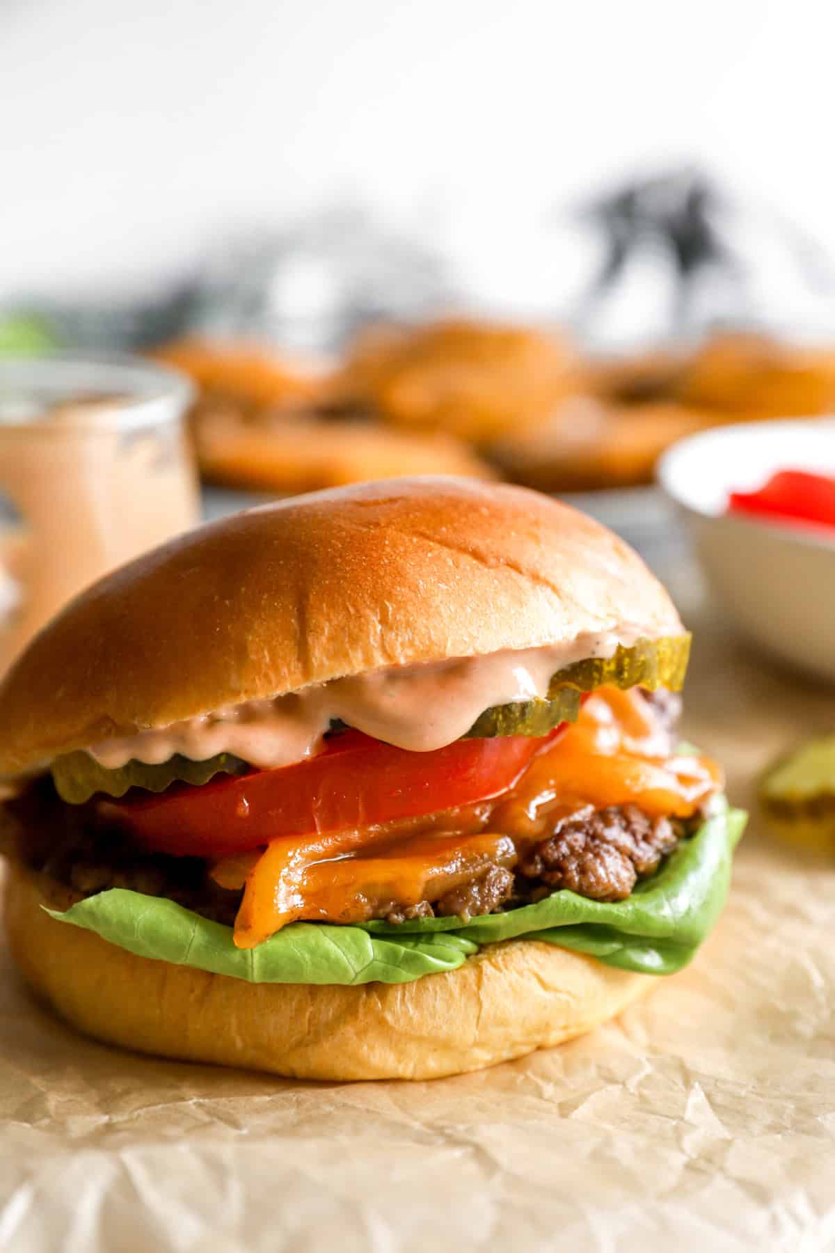 A homemade smash burger with burger sauce.