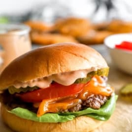 A homemade smash burger with burger sauce.