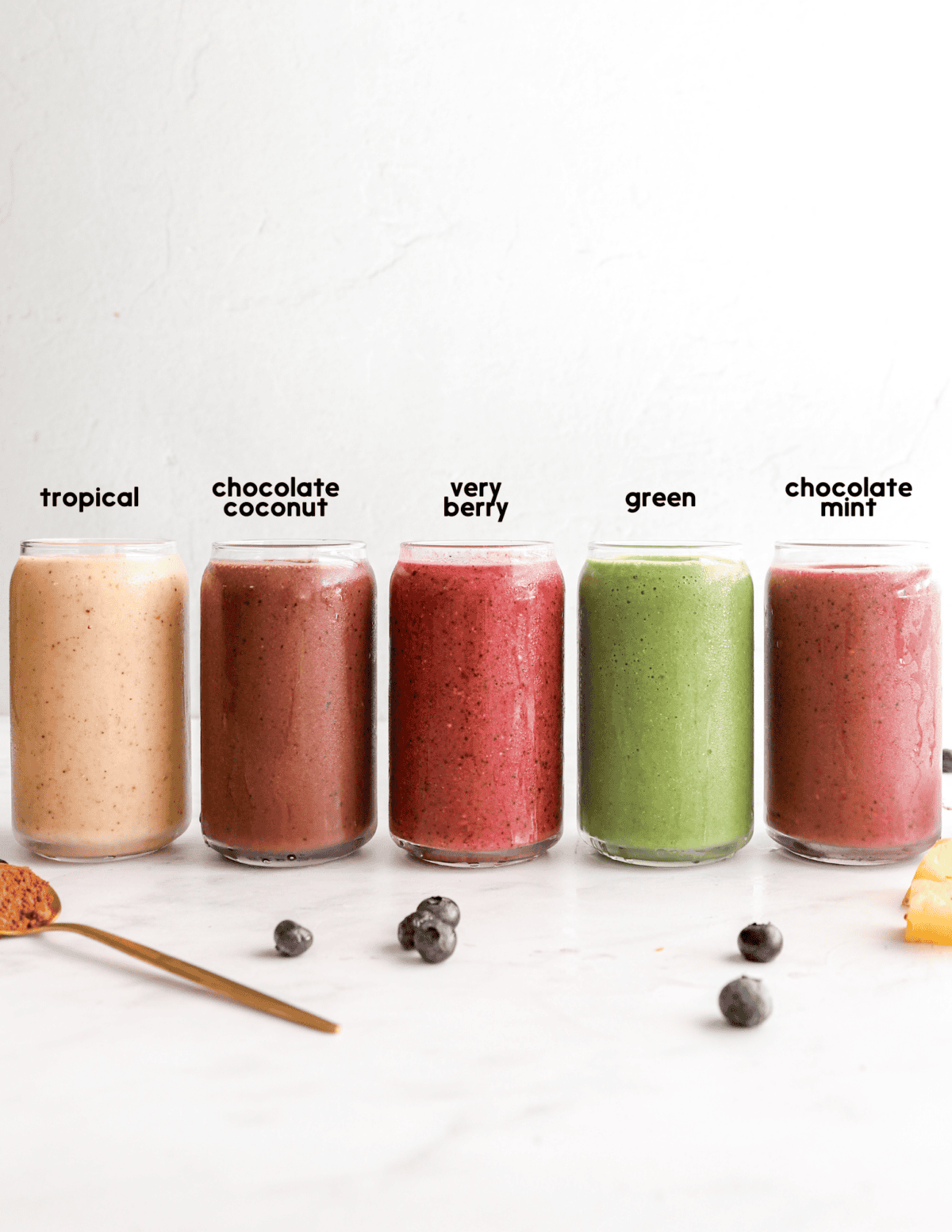 Five glasses of smoothies in different flavors. 