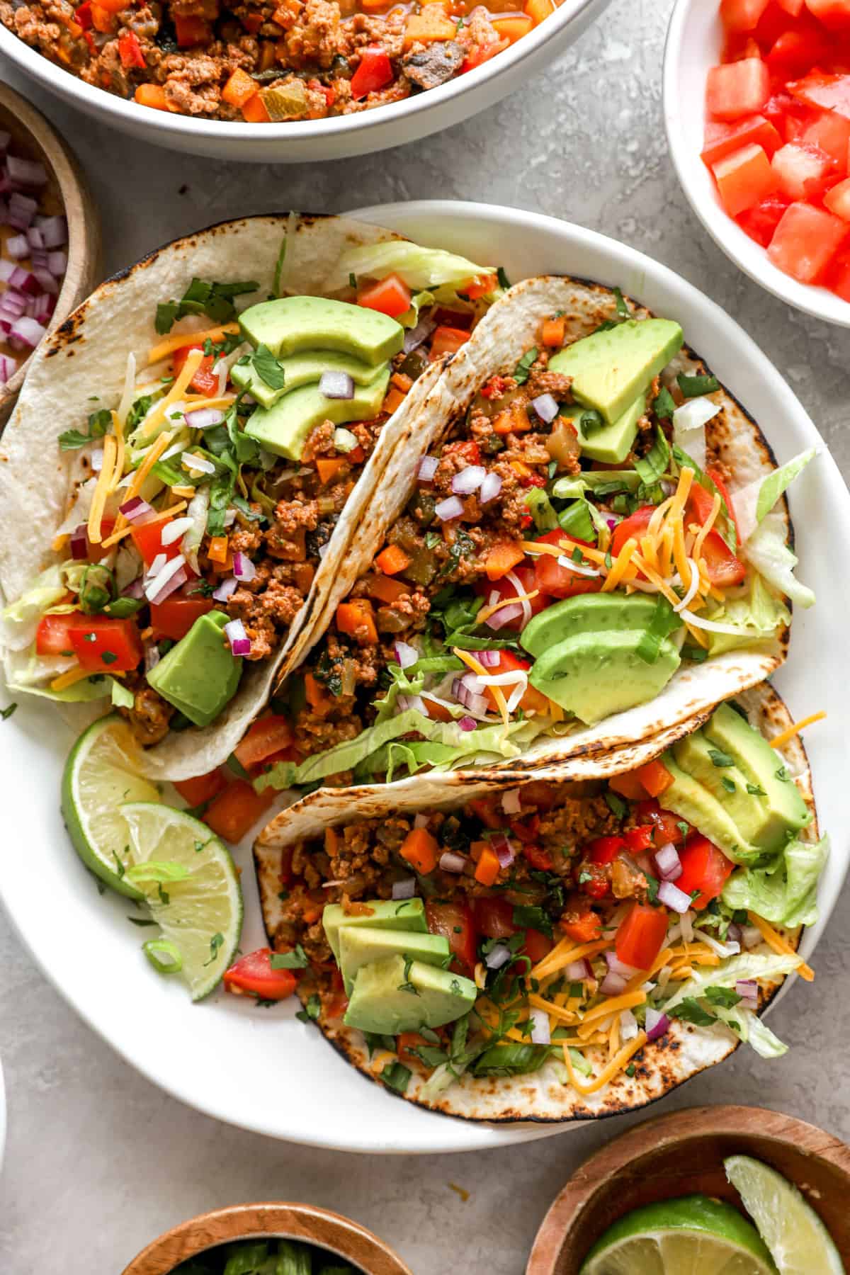 A plate of three tacos with Instant Pot taco meat. 