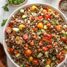 Overhead image of a bowl of Greek lentil salad.