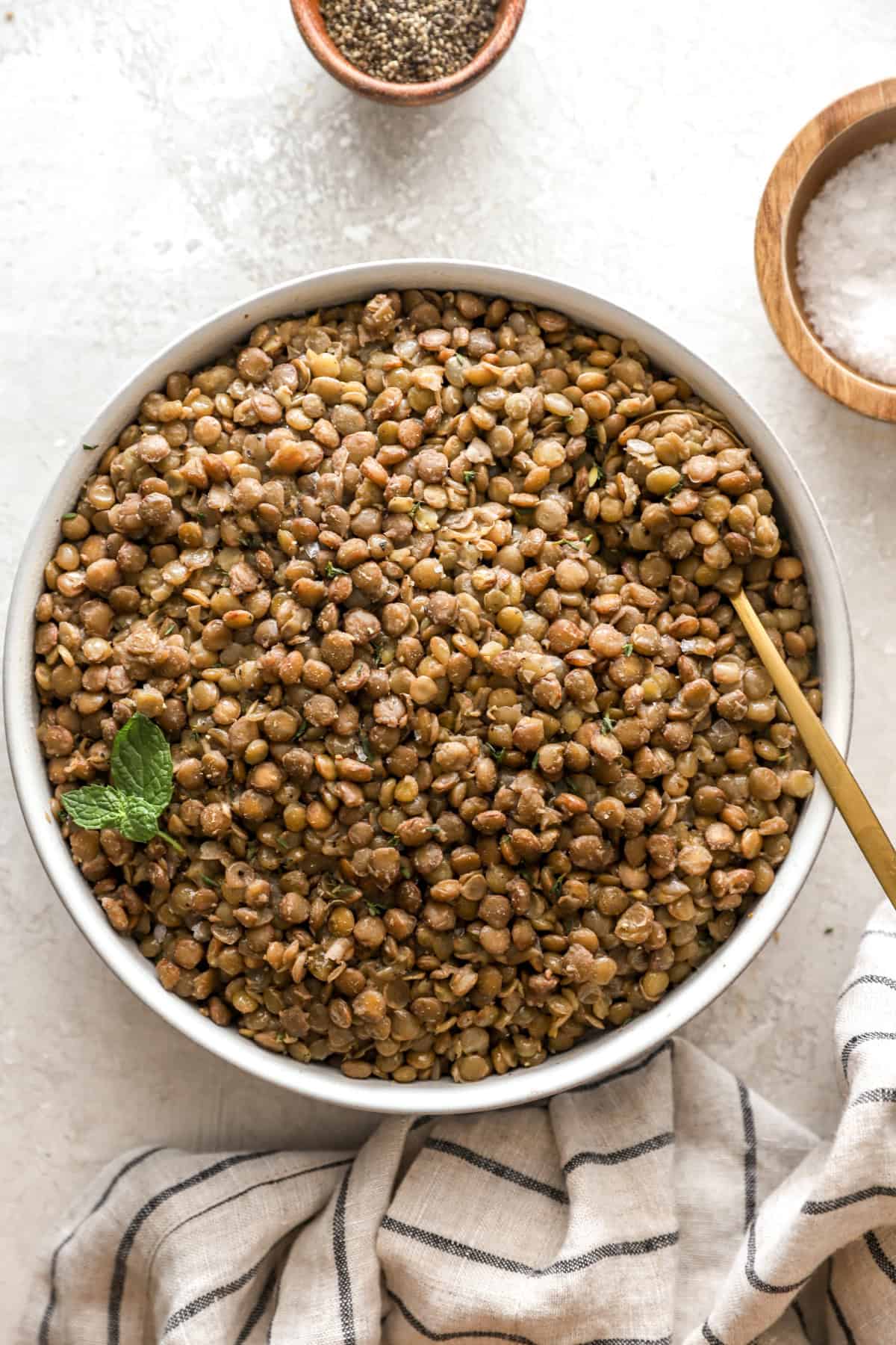 Overhead image of a bowl of cooked lentils. 