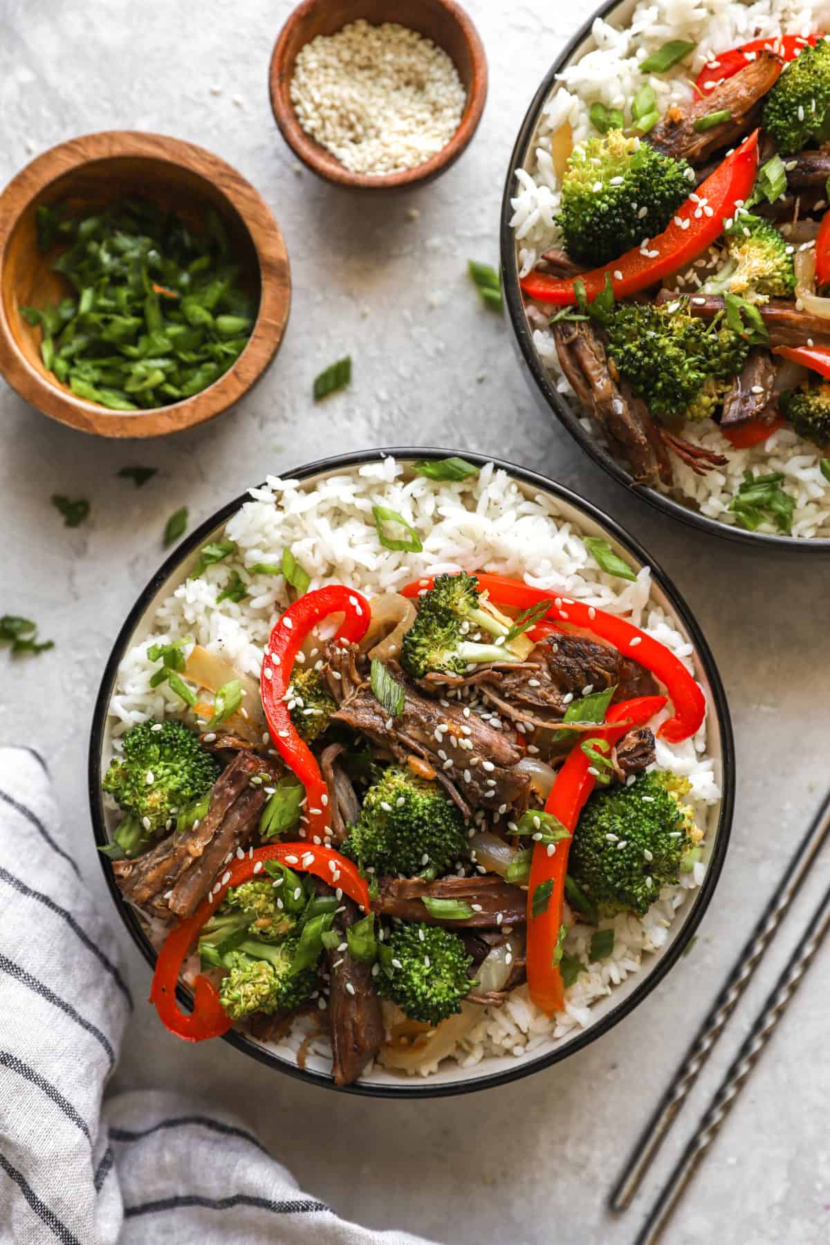 Overhead image of bowls of Paleo beef and rice with peppers. 