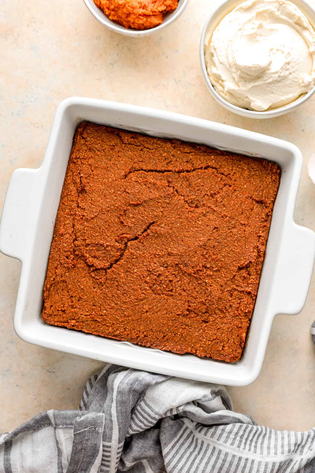 Baked gluten free pumpkin cake in a square dish. 