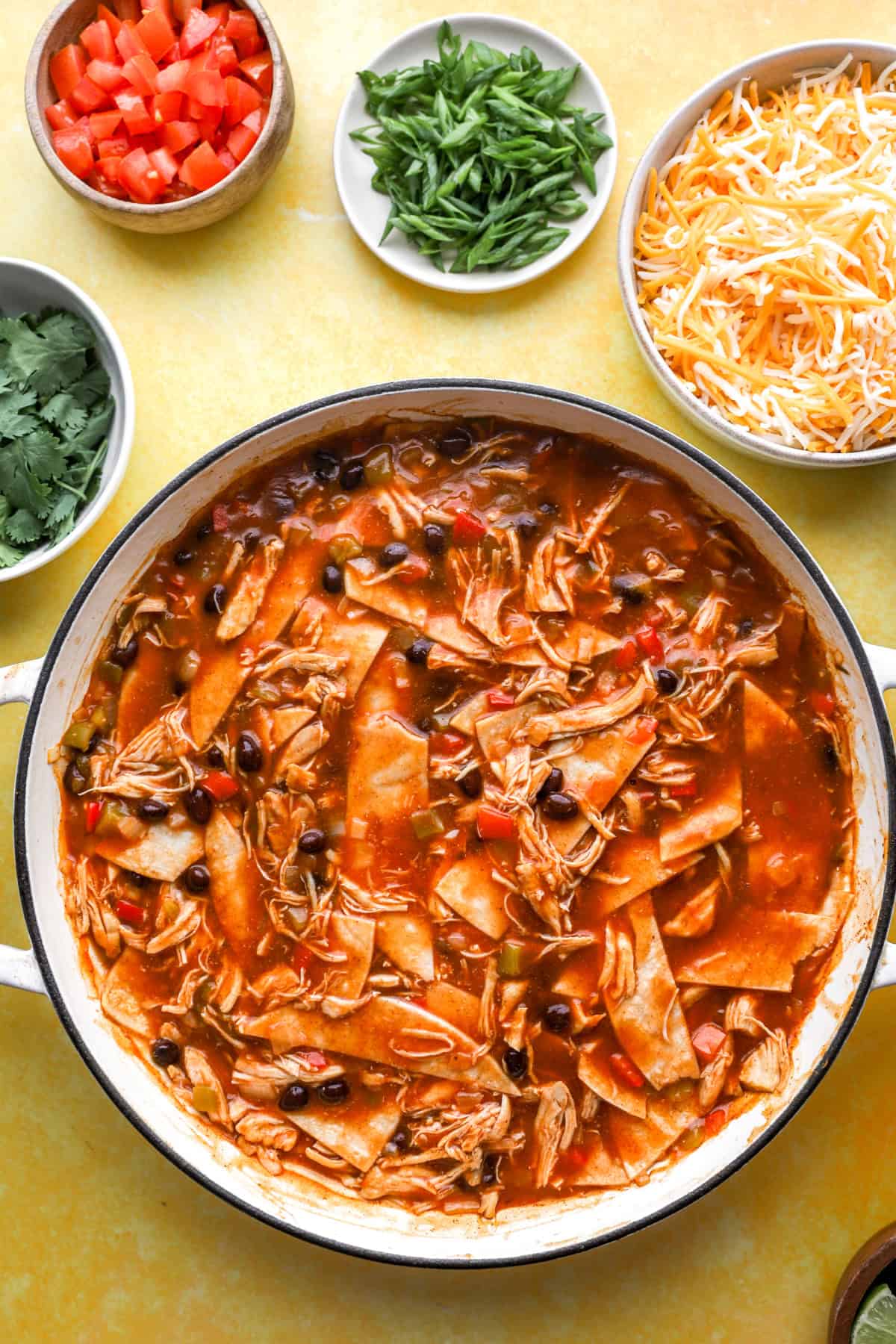 Overhead image of chicken skillet enchiladas filling in a skillet.