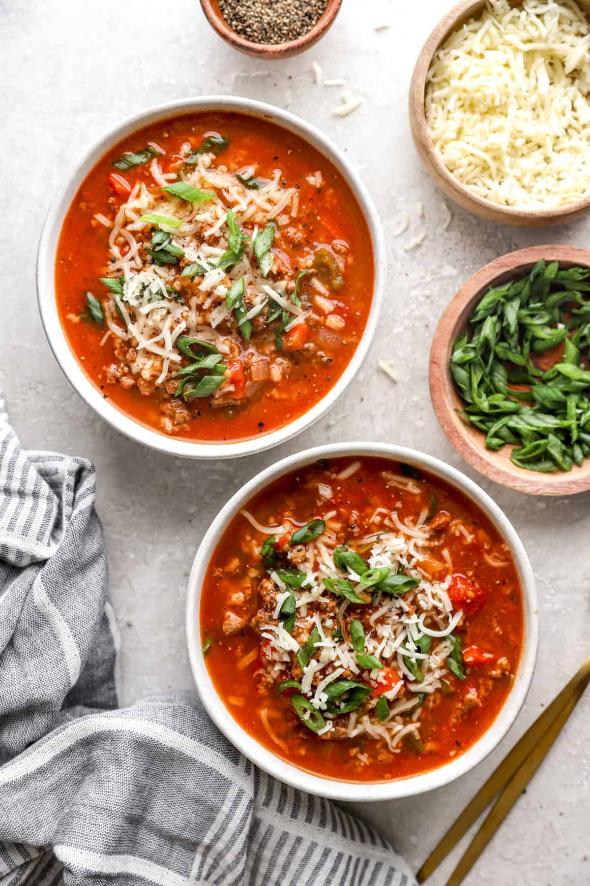 Overhead image of two bowls of slow cooker lasagna soup. 