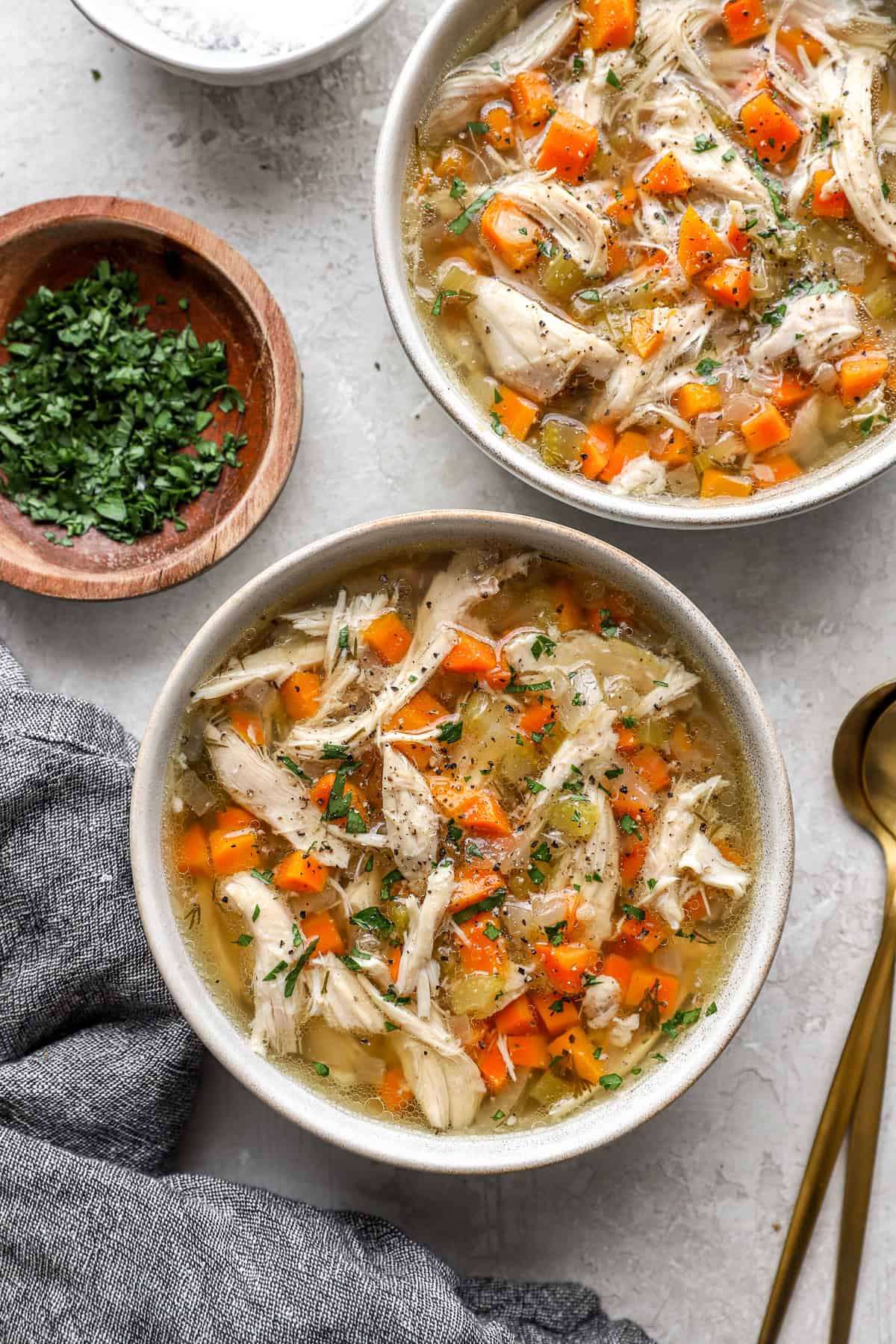 Two bowls of slow cooker chicken soup. 