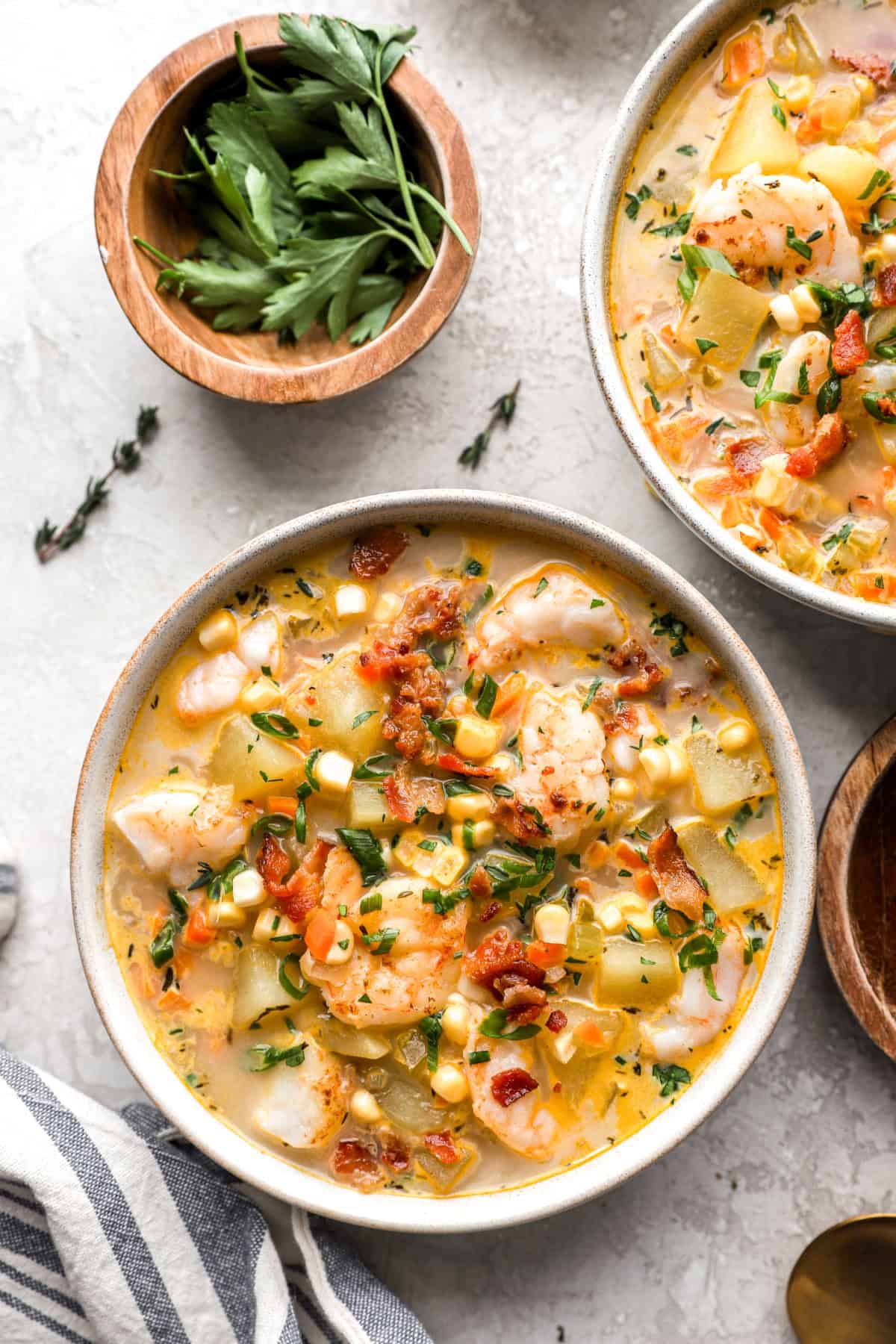 Overhead image of a bowl of creamy potato shrimp and corn chowder.