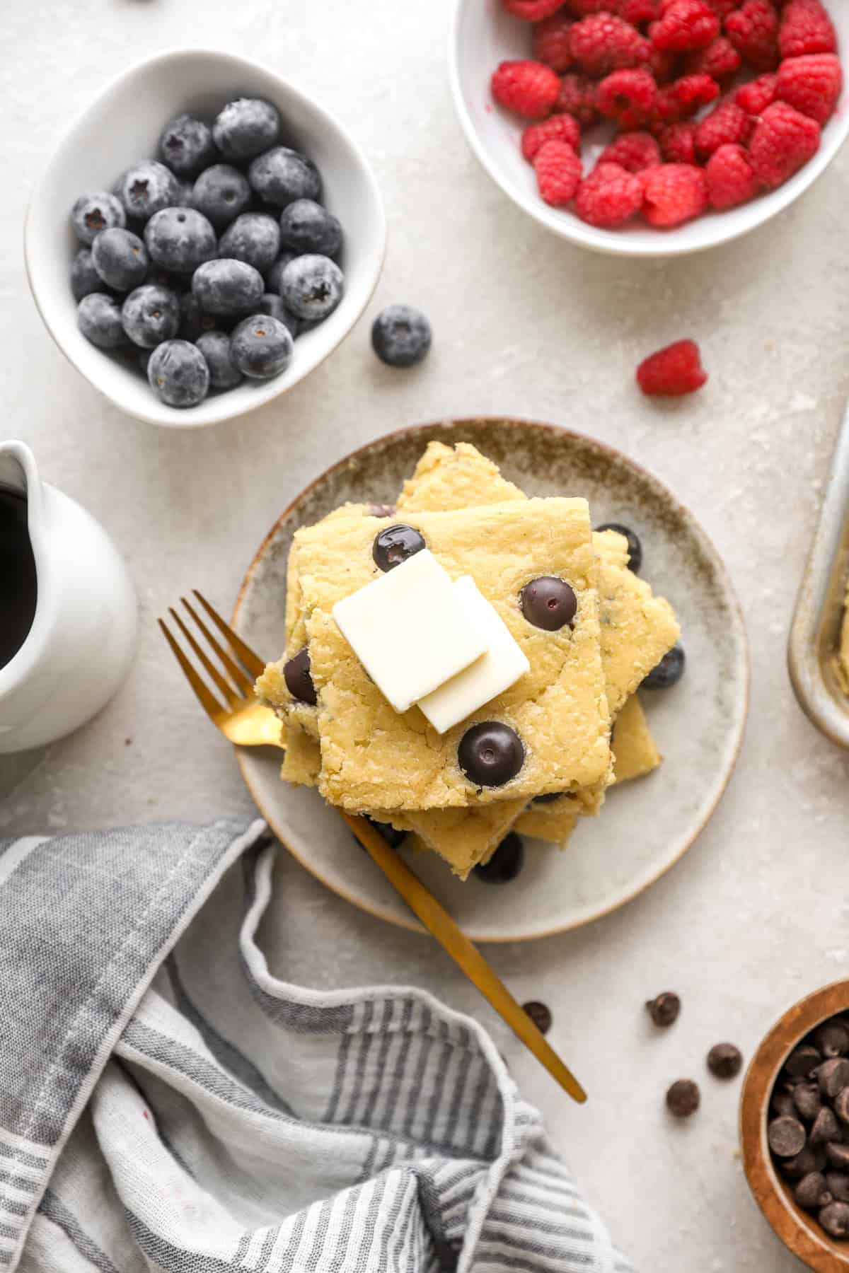 Overhead image of a plate of blueberry sheet pan pancakes. 