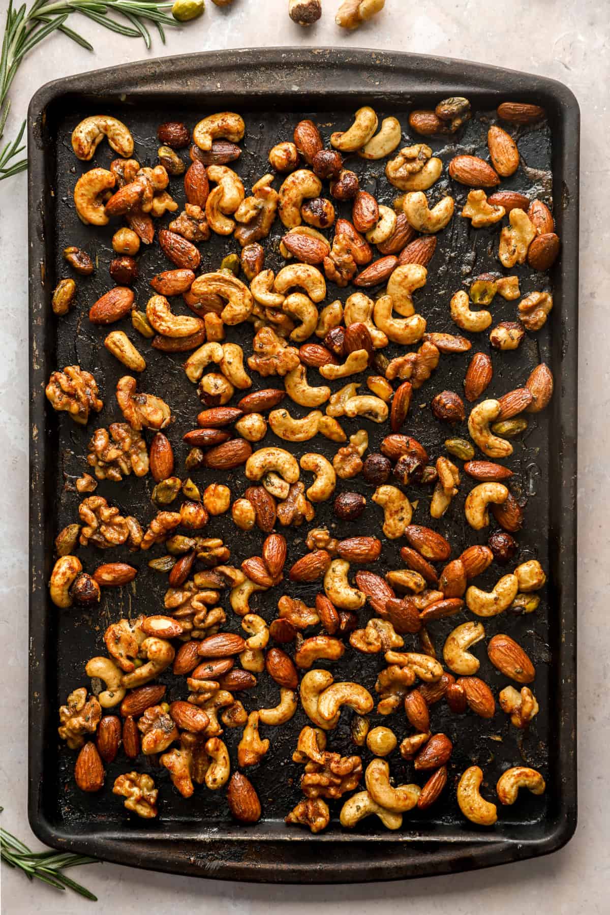 Baked spiced party nuts on a baking sheet. 