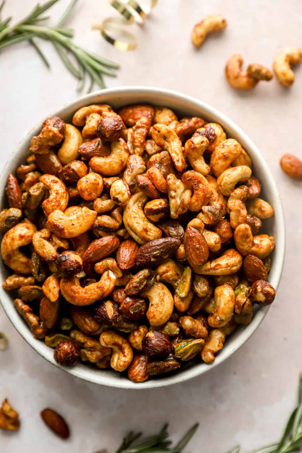 A bowl of spiced maple rosemary party nuts. 