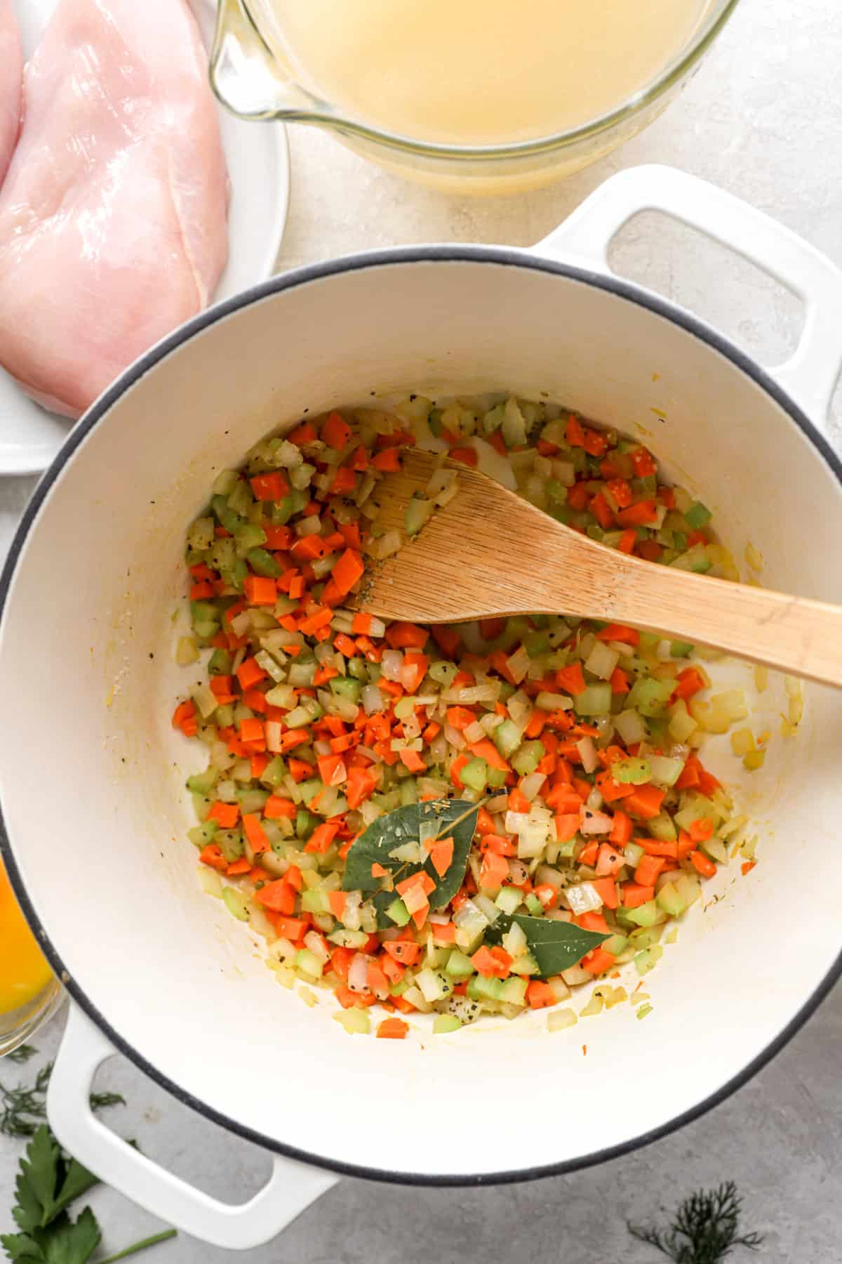 Carrots, celery, and onions being sautéed.