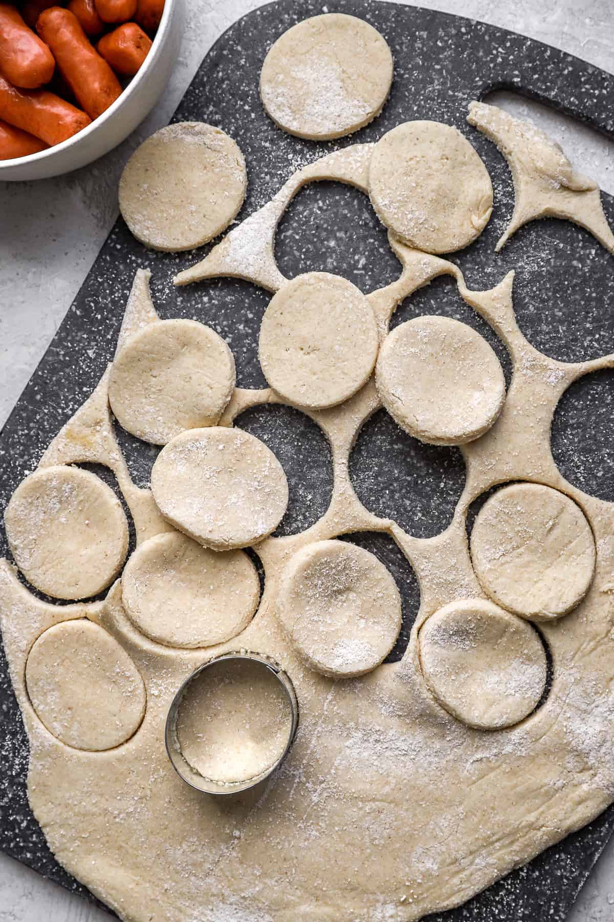 Gluten free dough being stamped into rounds. 