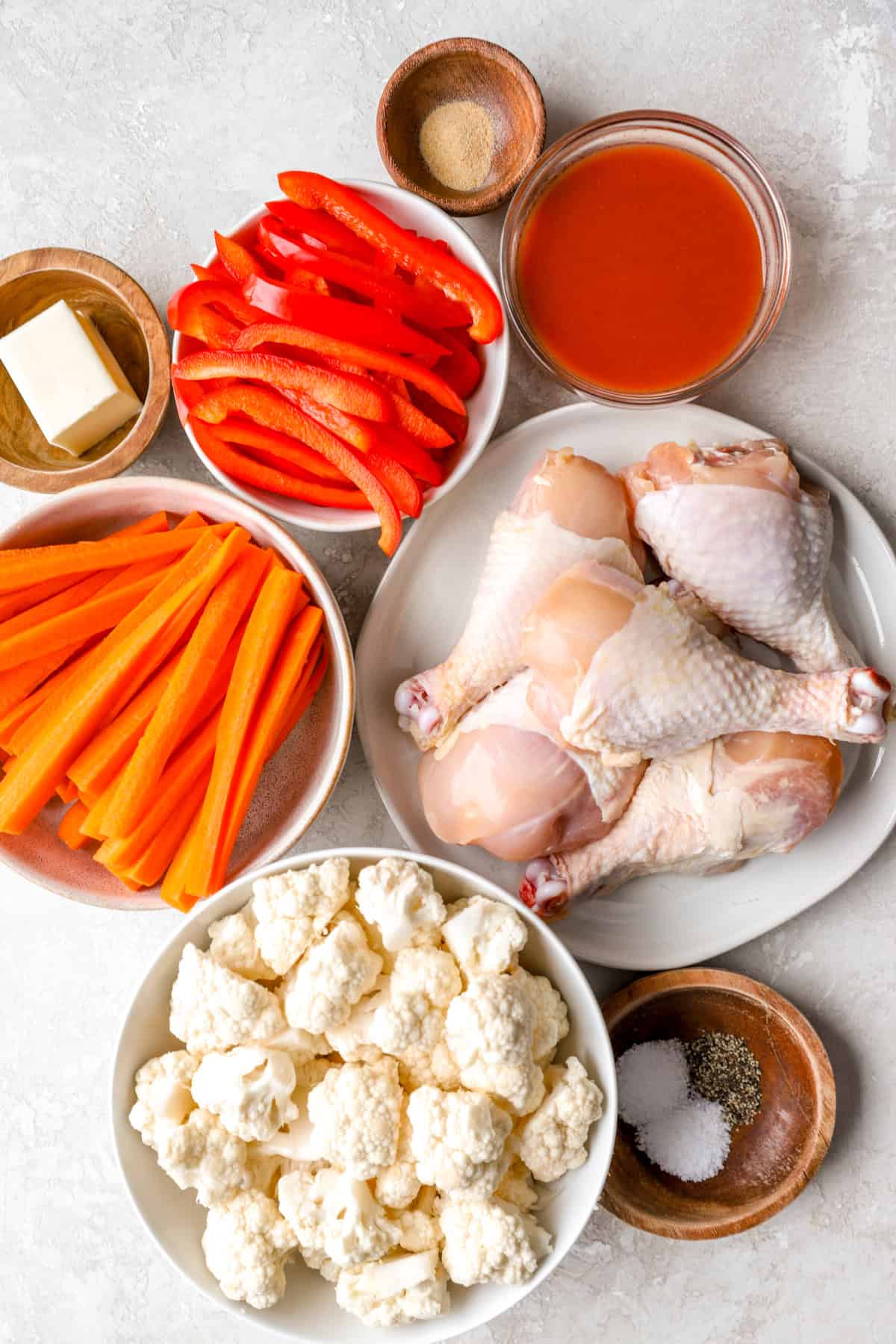 Sheet pan buffalo chicken and veggies ingredients. 