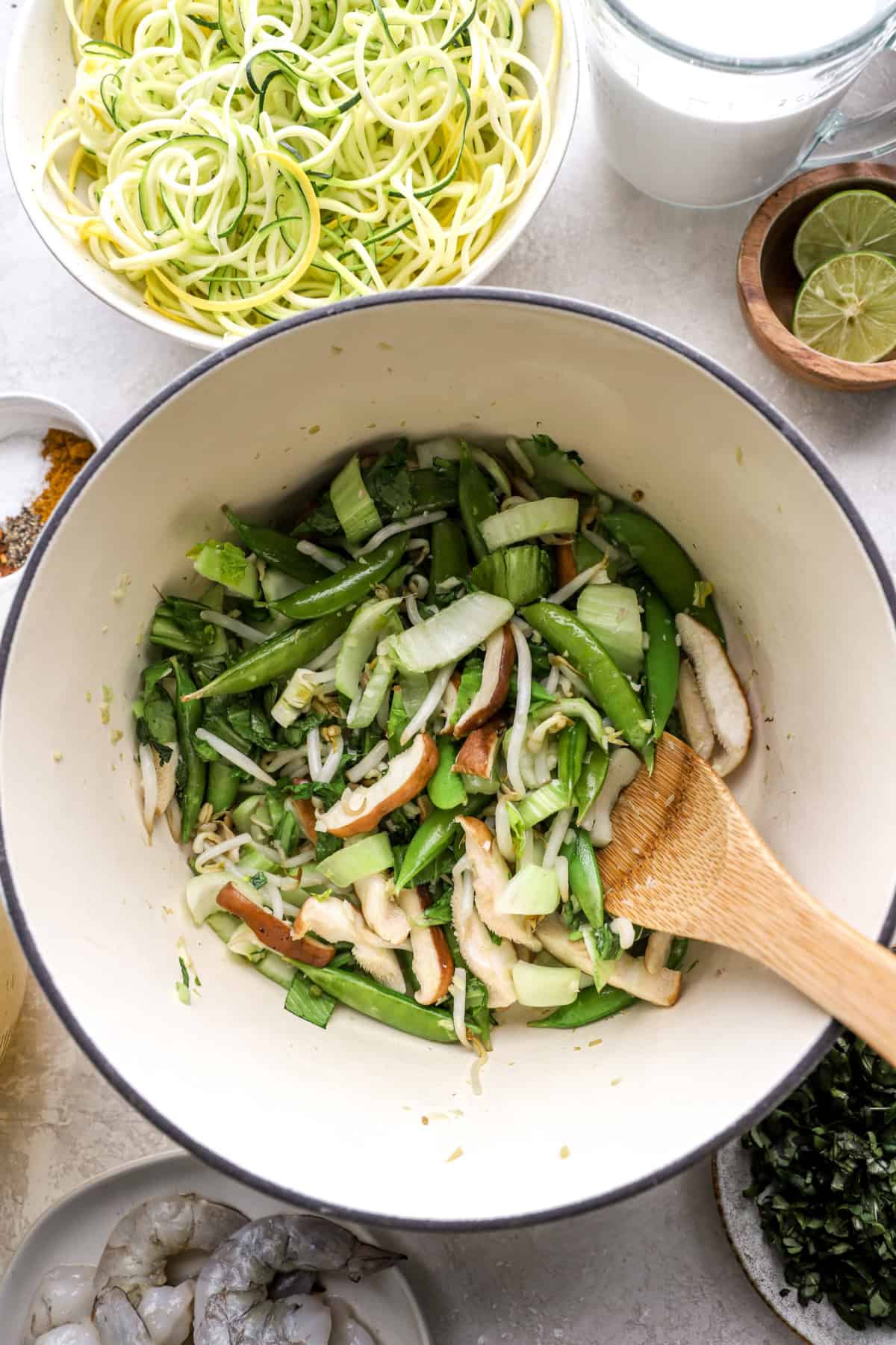 Vegetables sautéing in a pot. 