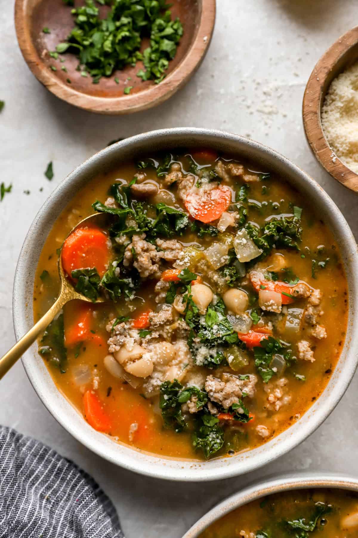 Overhead image of a bowl of Tuscan white bean soup. 