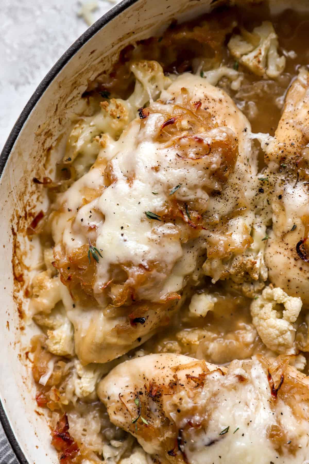 French onion baked chicken in a skillet. 