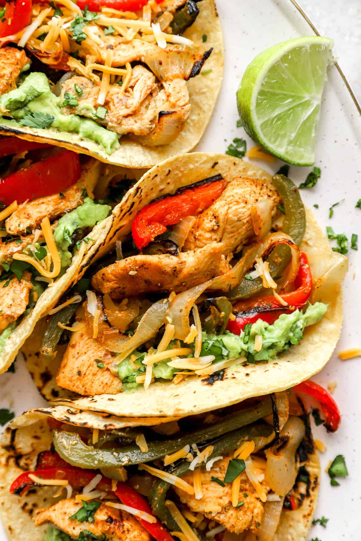 Close up image of sheet pan chicken fajita tacos. 