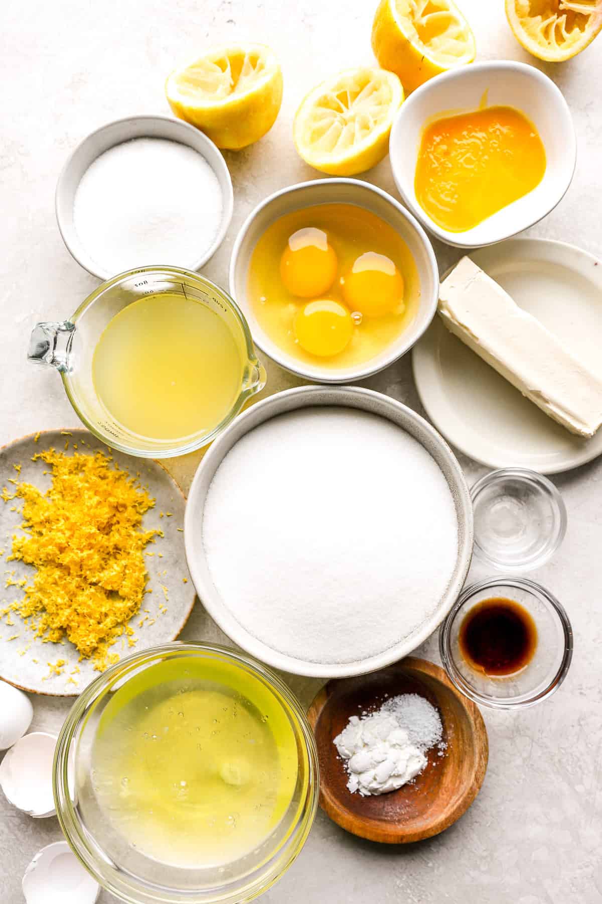 Ingredients to make a mini pavlova dessert with lemon curd.