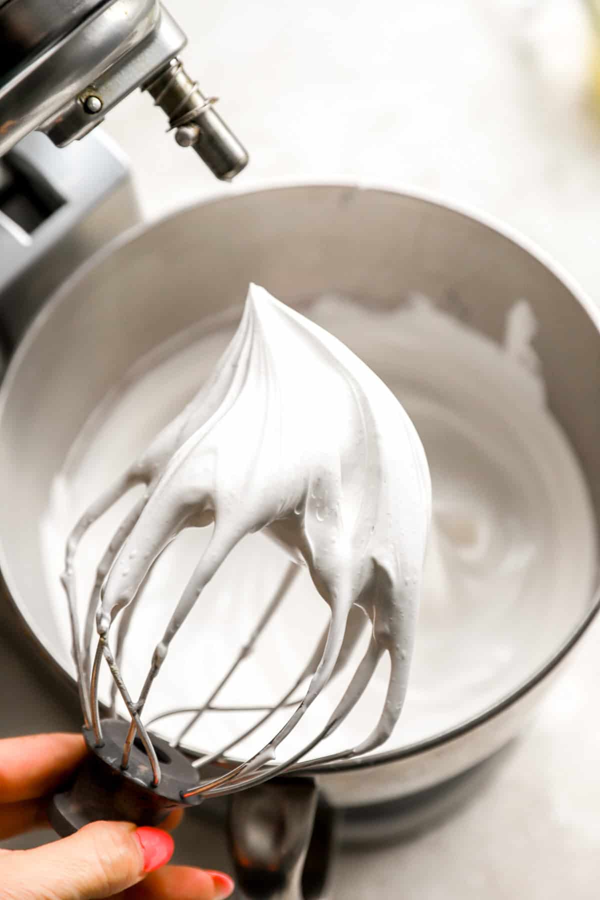Whipped meringue on a whisk attachment.