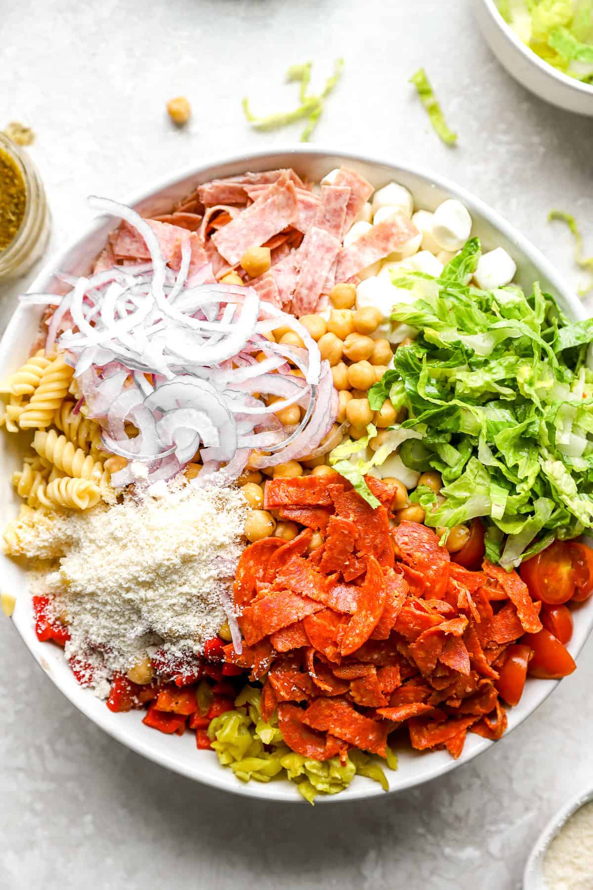 Grinder pasta salad ingredients in a bowl. 