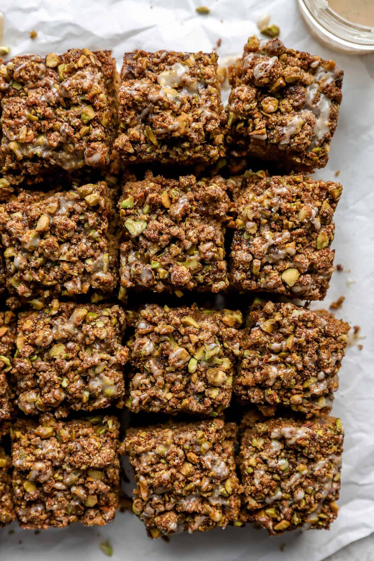 Pistachio snack cake sliced into squares. 