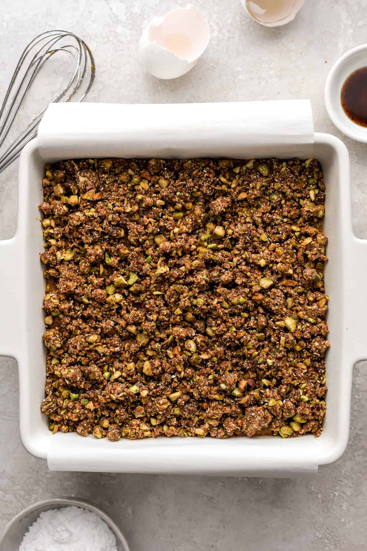 Unbaked pistachio cake with streusel topping. 