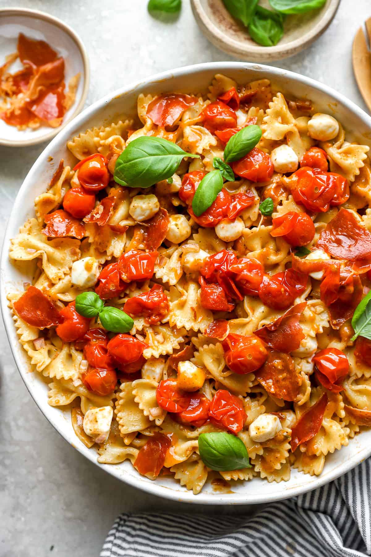 Confit caprese pasta salad in a bowl. 