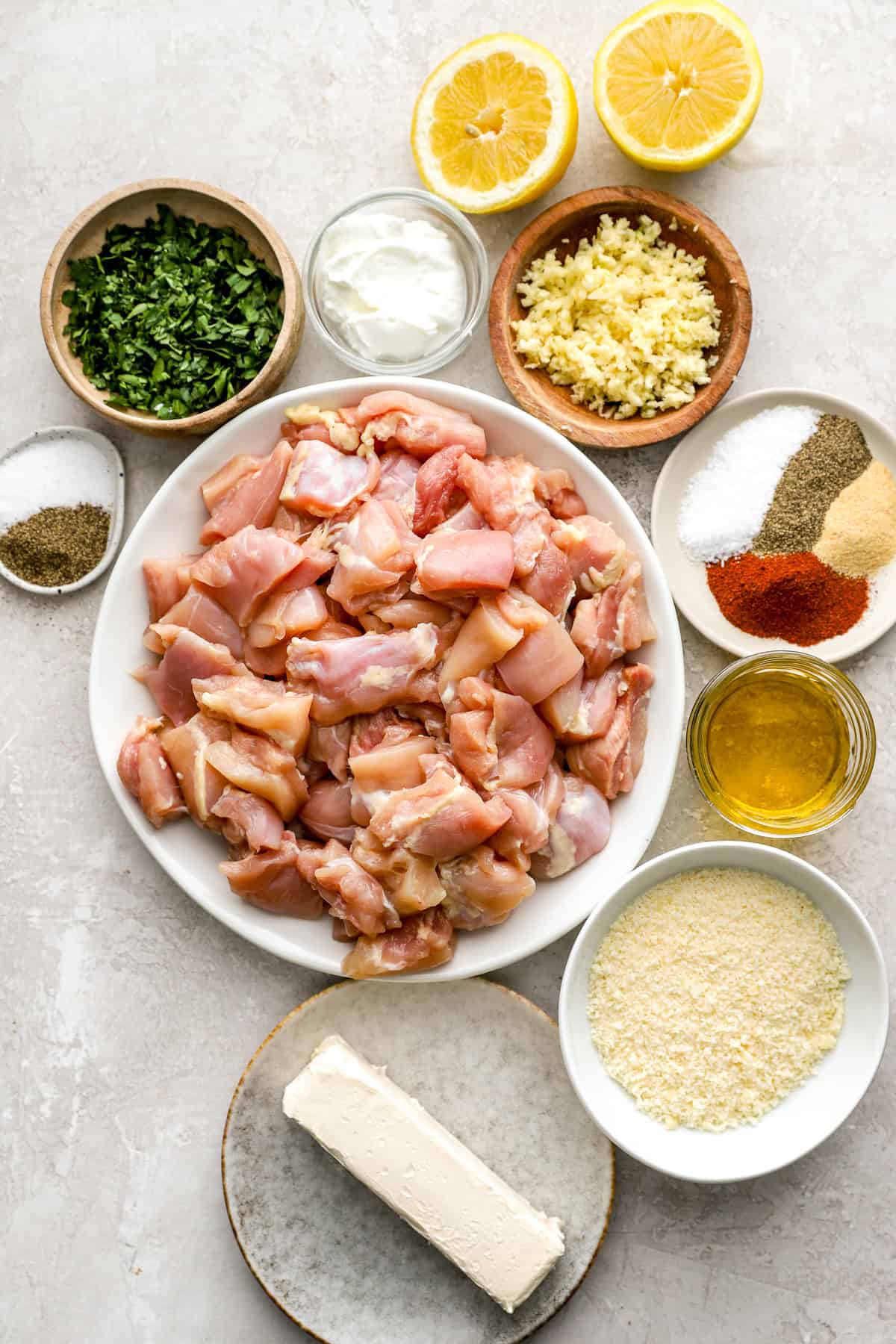 Ingredients for lemon pepper Parmesan chicken skewers.