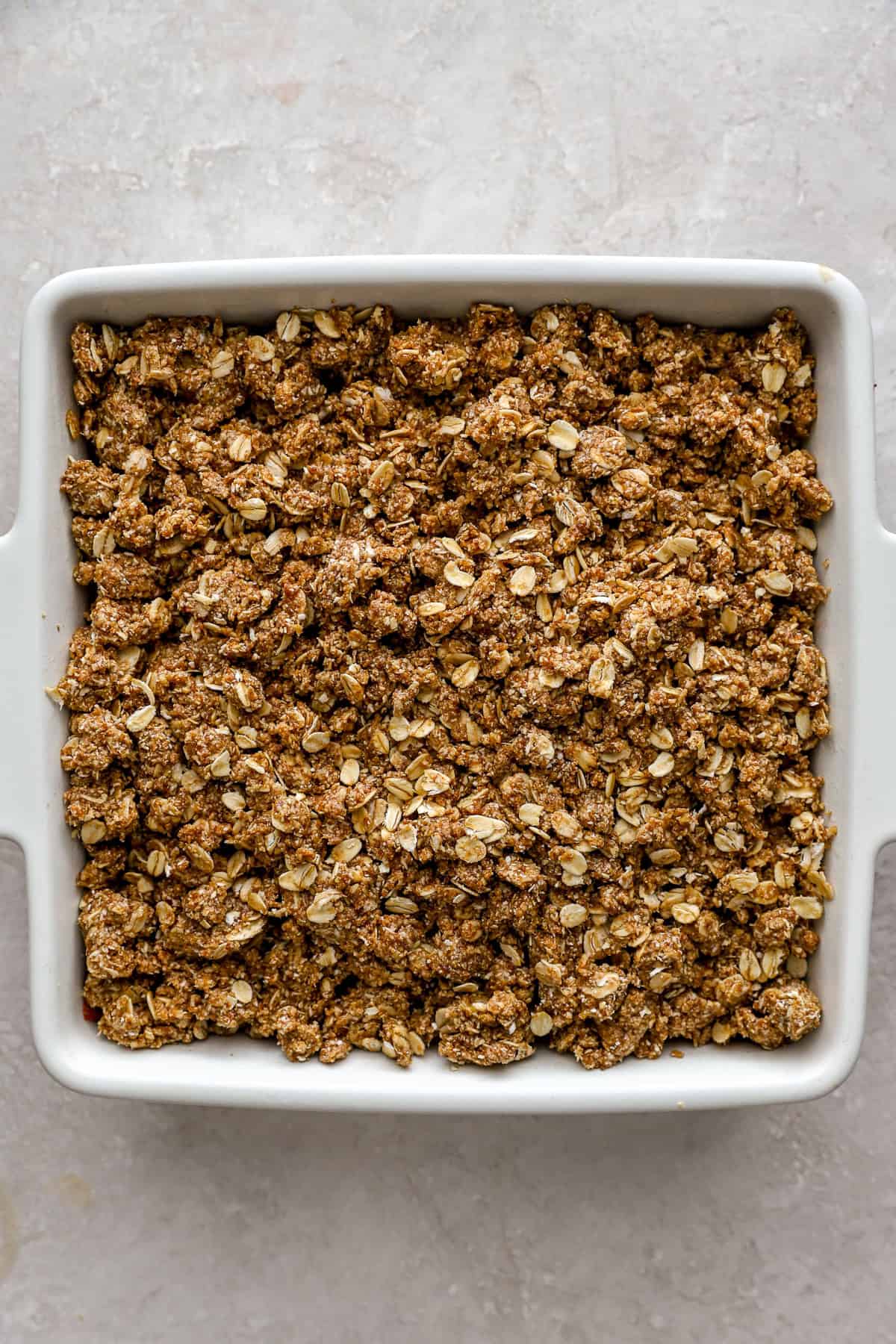 Unbaked strawberry crisp with oats. 