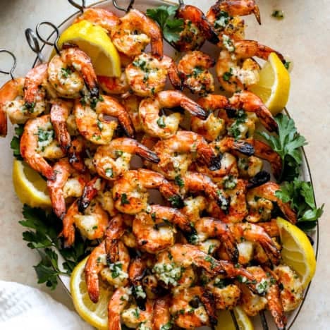 A platter of grilled shrimp skewers.