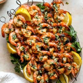 A platter of grilled shrimp skewers.