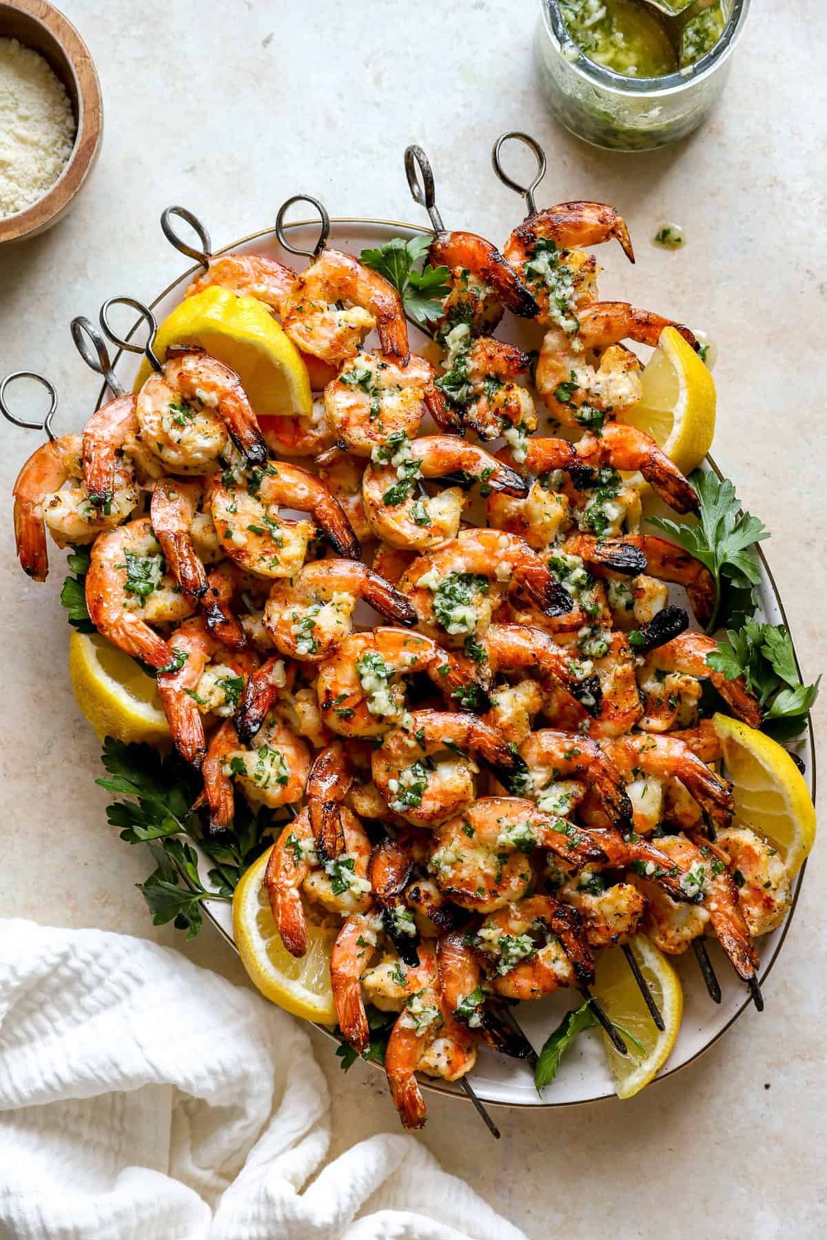 A platter of grilled shrimp skewers.