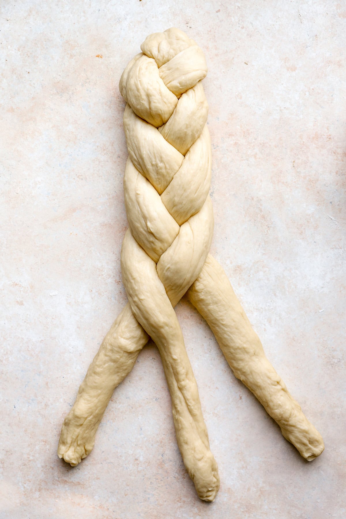 A half braided Challah bread loaf.