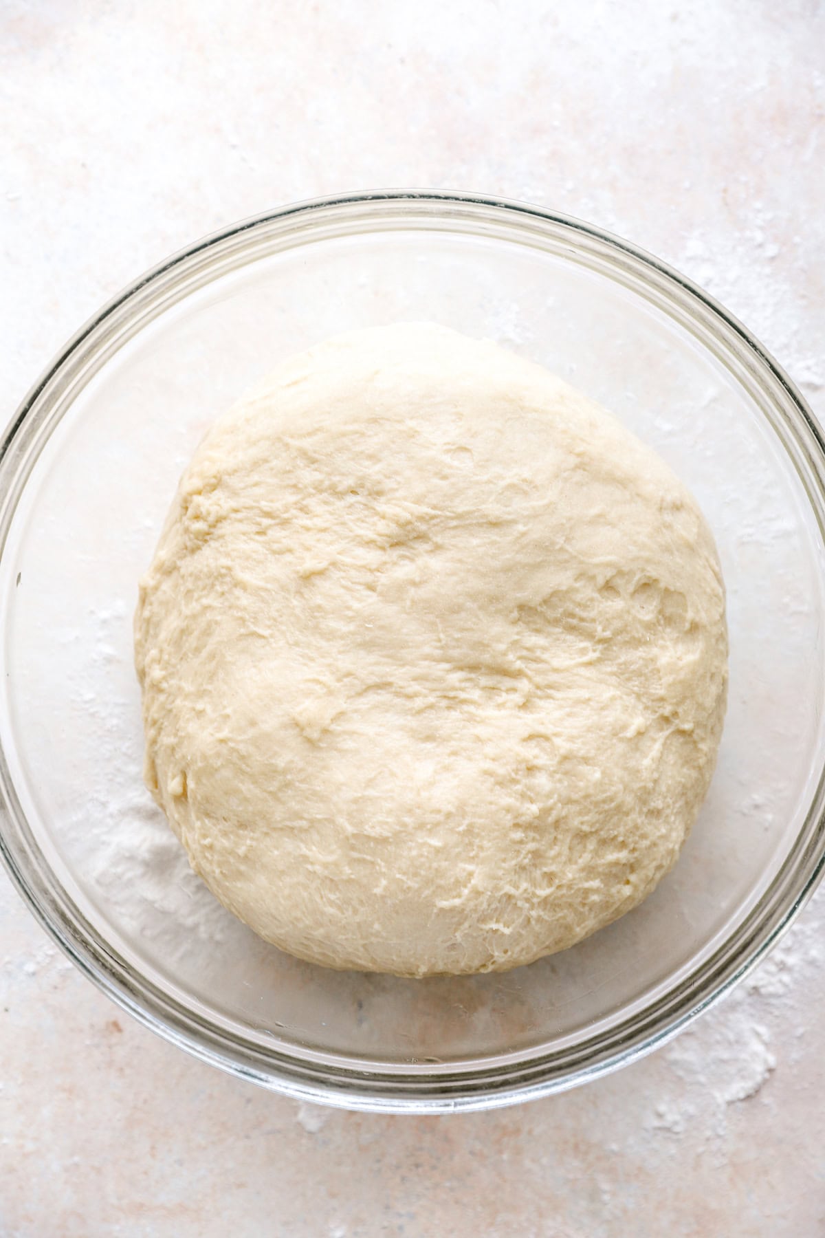 Challah bread dough proofing in a bowl.
